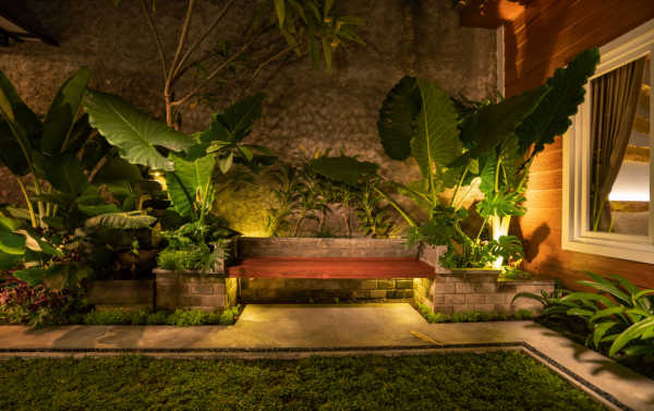 Bench lit up in a yard - landscape lighting